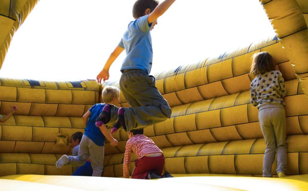 Kids in bouncy house.