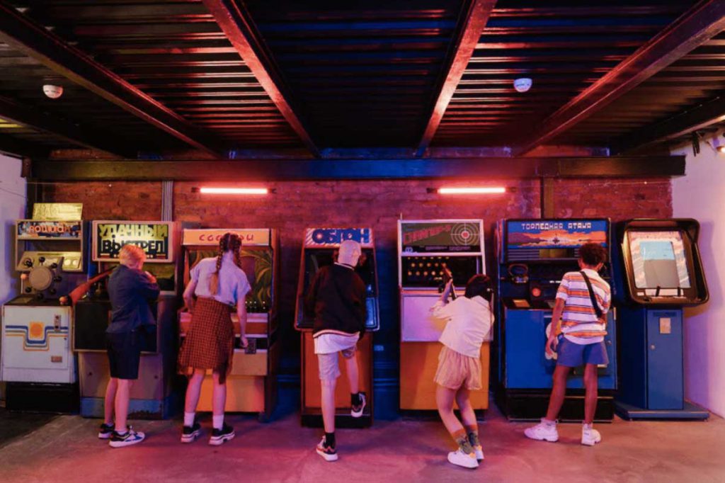 People playing arcade games. 